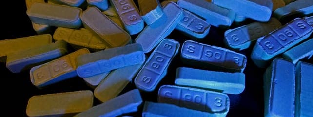 close-up-of-xanax-tablets-in-blue-light